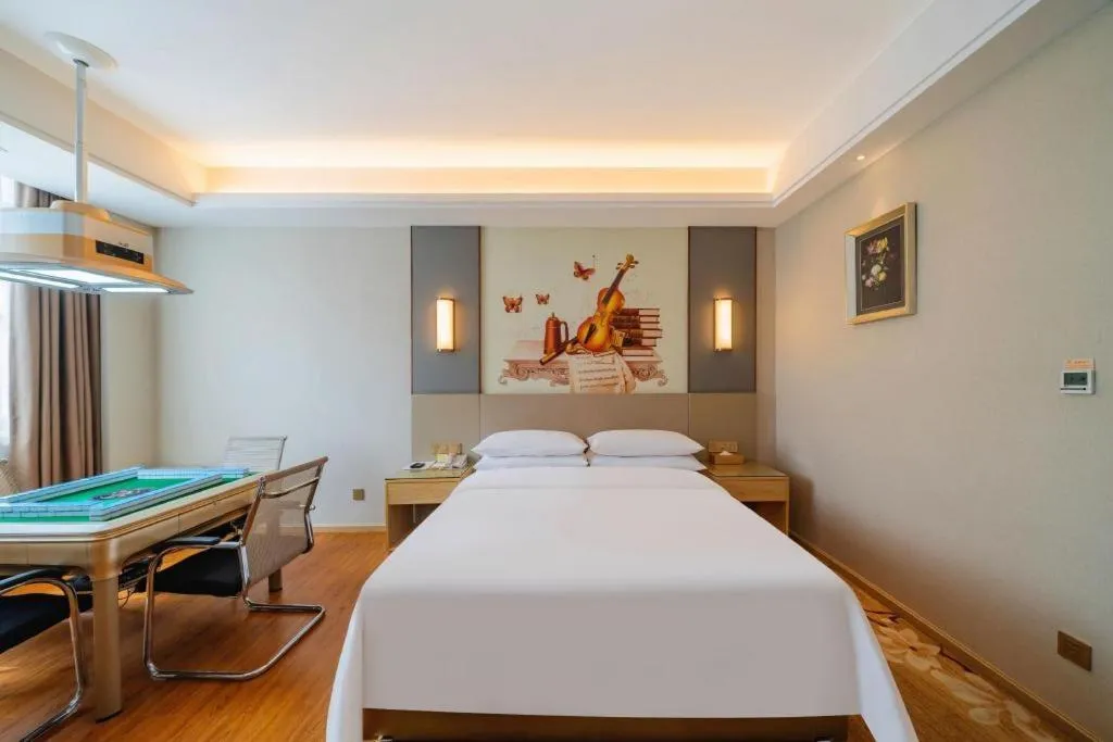 Bed in Vienna Hotel Guangdong Shaoguan Shaonan Avenue