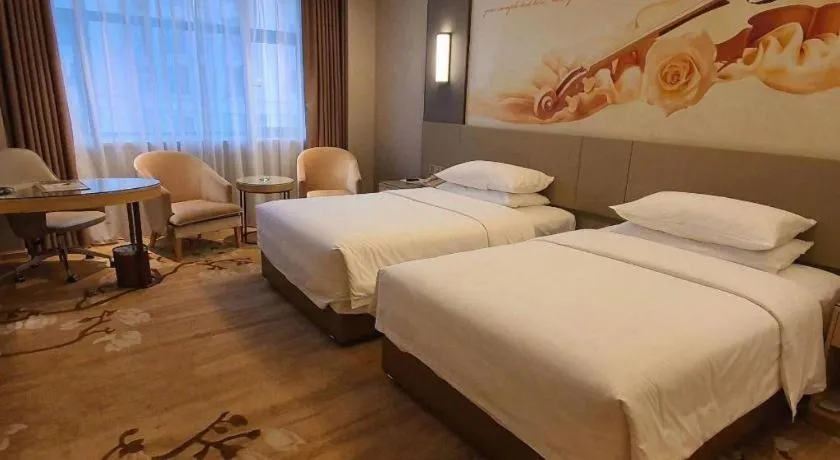 Bed in Vienna Hotel Guangdong Shaoguan Shaonan Avenue