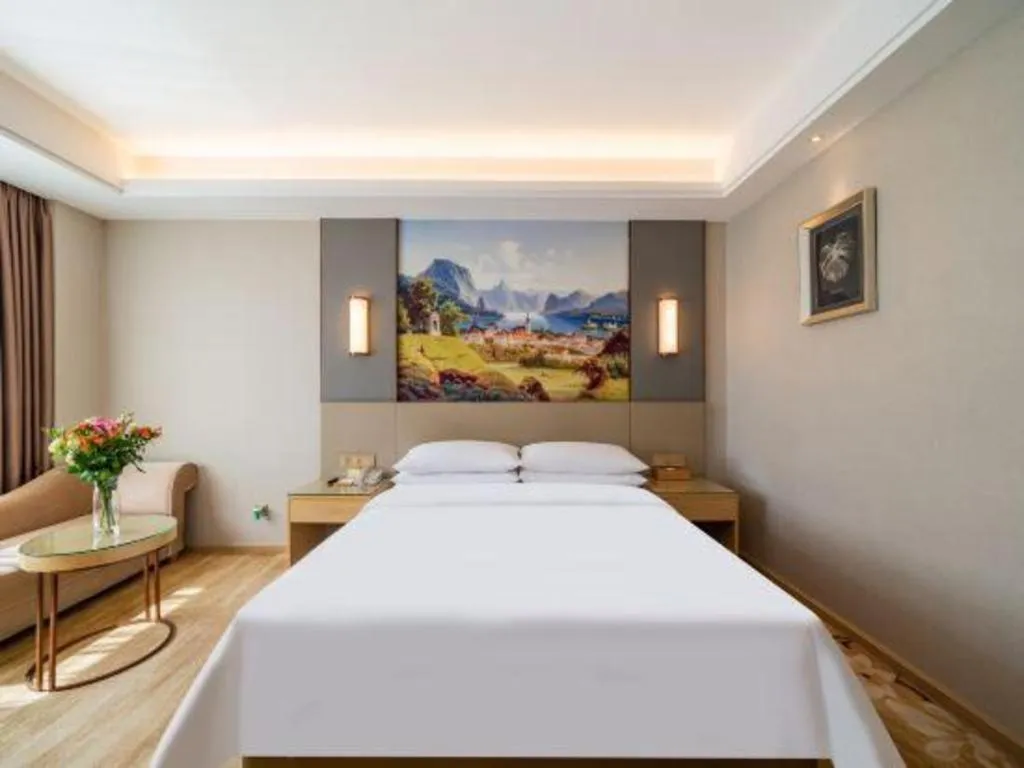 Bed in Vienna Hotel Guangdong Shaoguan Shaonan Avenue