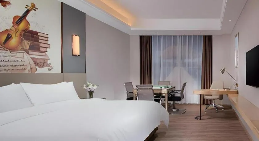 Bed in Vienna Hotel Guangdong Shaoguan Shaonan Avenue