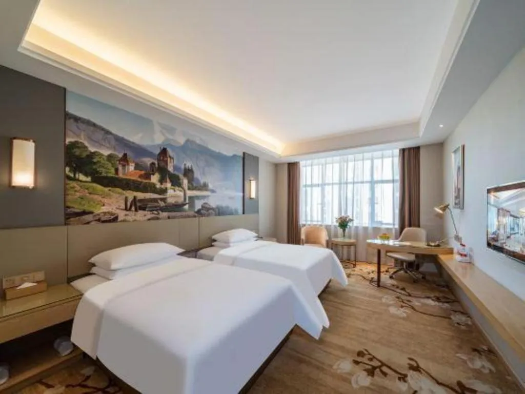 Bed in Vienna Hotel Guangdong Shaoguan Shaonan Avenue