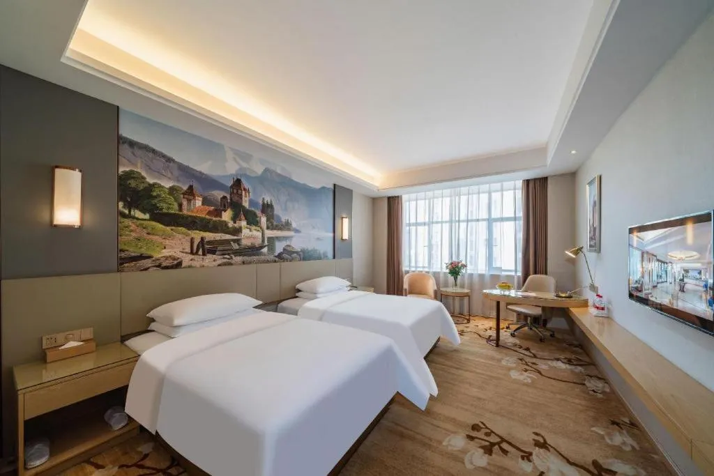 Bed in Vienna Hotel Guangdong Shaoguan Shaonan Avenue