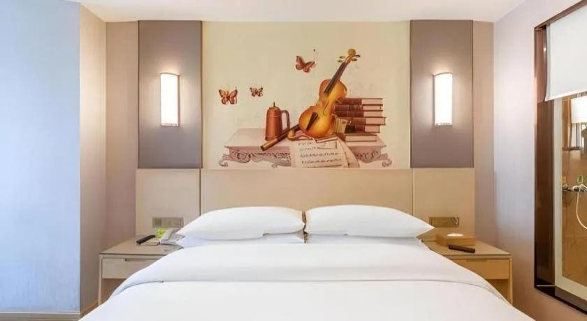 Bed in Vienna Hotel Hunan Huaihua Xupu Wanda Plaza