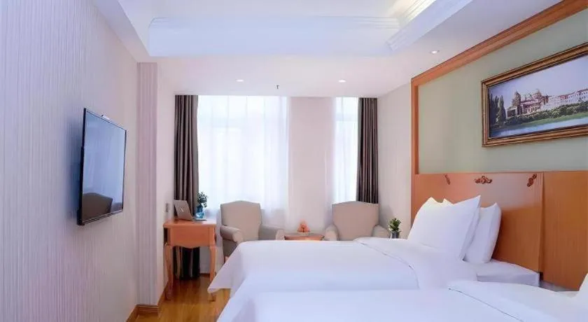 Bed in Vienna Hotel Inner Mongolia Tongliao Development Zone