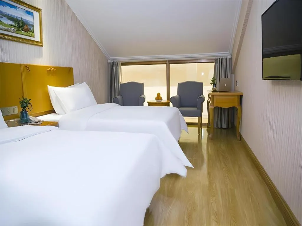 Bed in Vienna Hotel Inner Mongolia Tongliao Development Zone