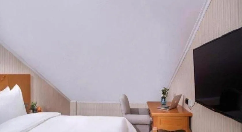 Bed in Vienna Hotel Inner Mongolia Tongliao Development Zone