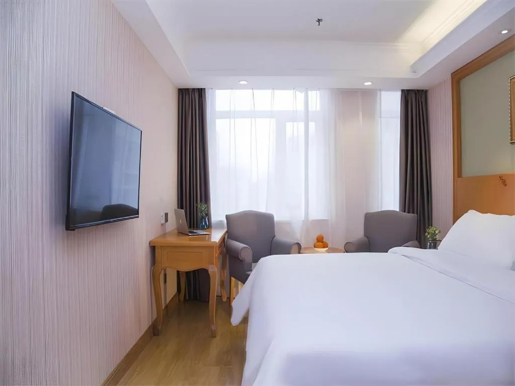 Bed in Vienna Hotel Inner Mongolia Tongliao Development Zone