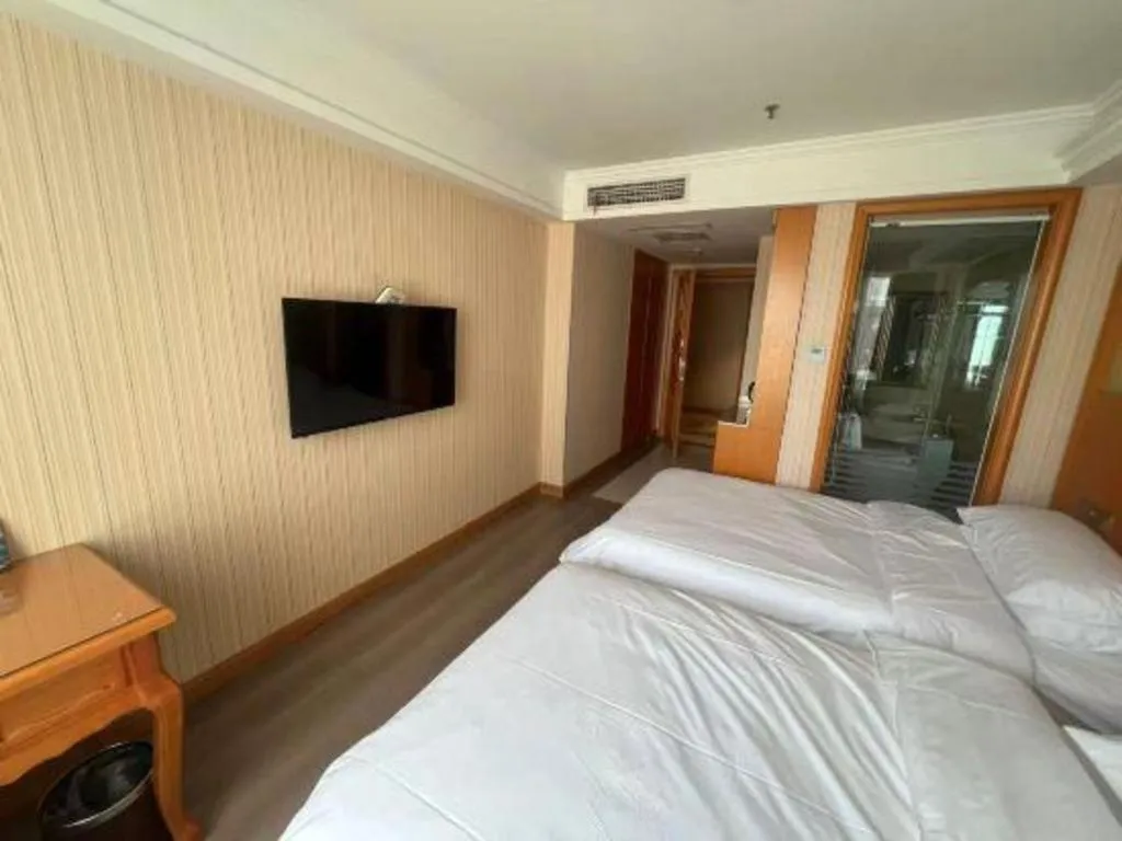 Bed in Vienna Hotel Inner Mongolia Tongliao Development Zone