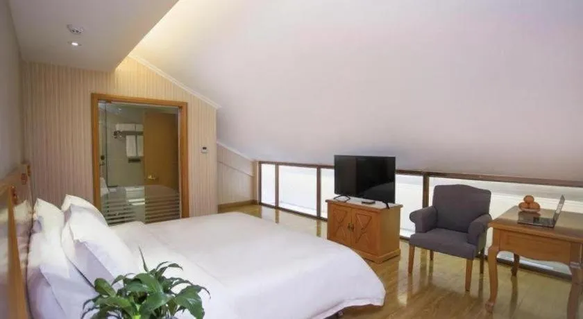 Bed in Vienna Hotel Inner Mongolia Tongliao Development Zone