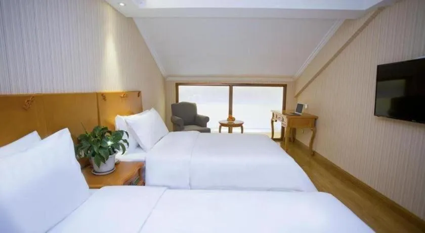 Bed in Vienna Hotel Inner Mongolia Tongliao Development Zone