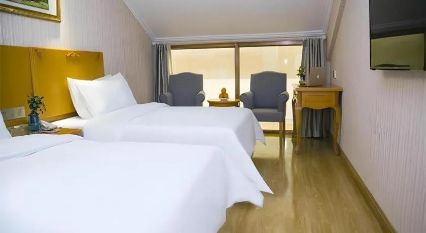 Bed in Vienna Hotel Inner Mongolia Tongliao Development Zone