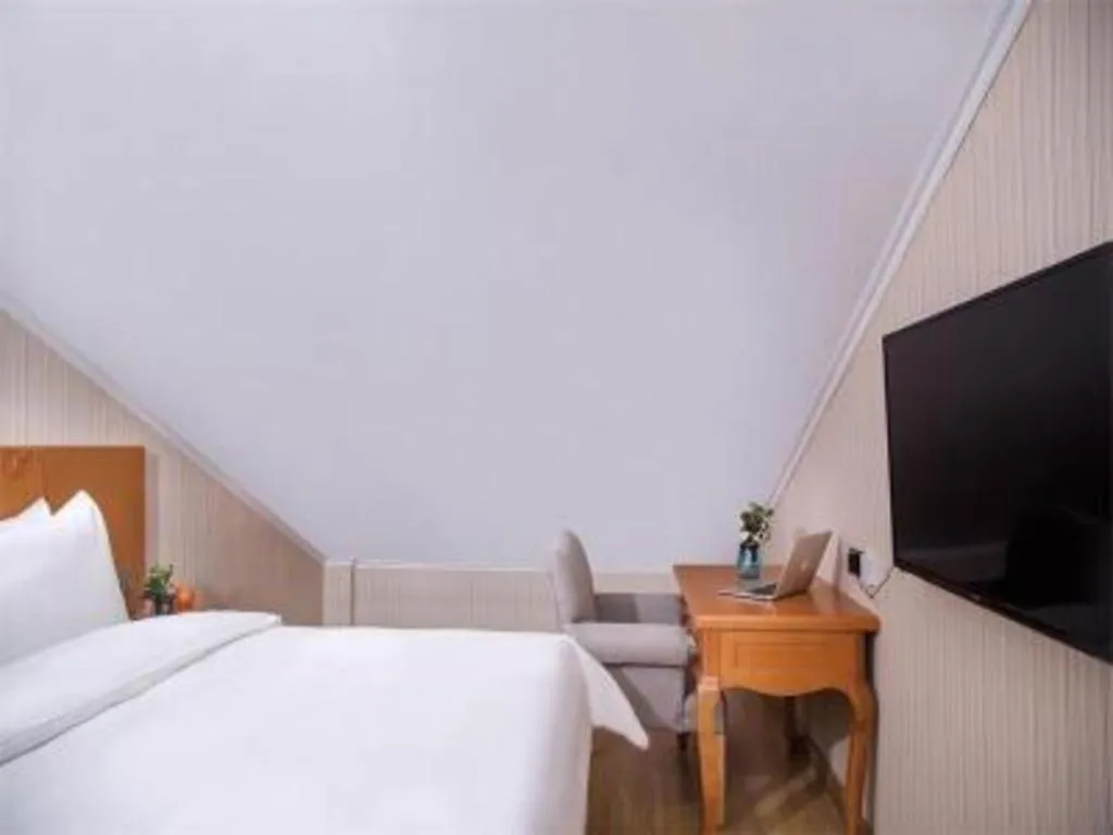 Bed in Vienna Hotel Inner Mongolia Tongliao Development Zone