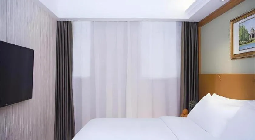 Bed in Vienna Hotel Inner Mongolia Tongliao Development Zone