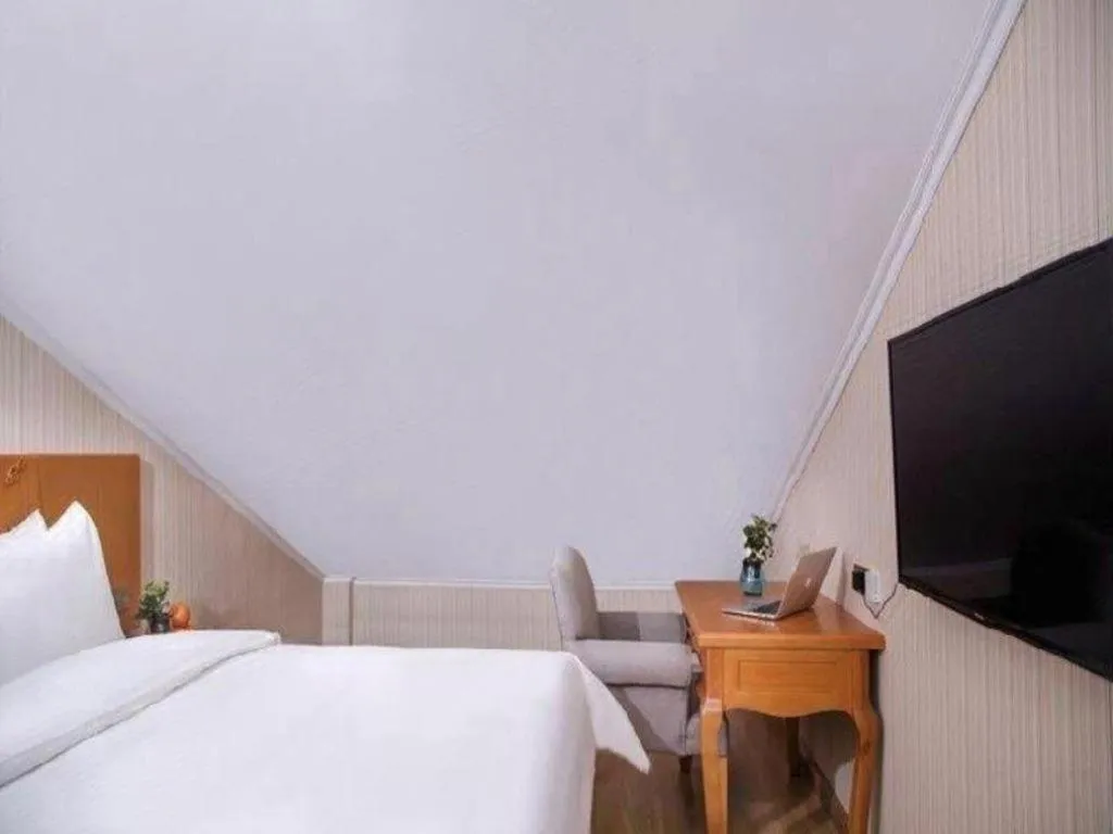 Bed in Vienna Hotel Inner Mongolia Tongliao Development Zone