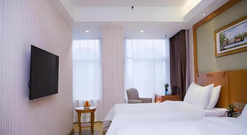 Bed in Vienna Hotel Inner Mongolia Tongliao Development Zone