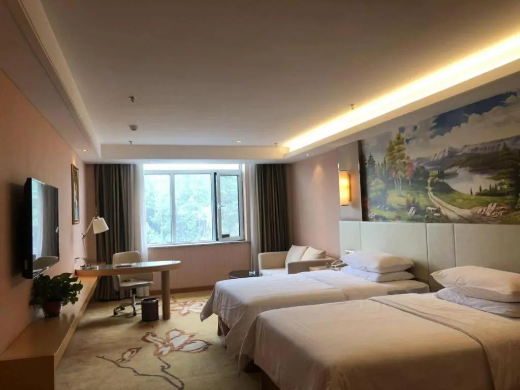 Bed in Vienna Hotel Shandong Qufu Sankong Landscape
