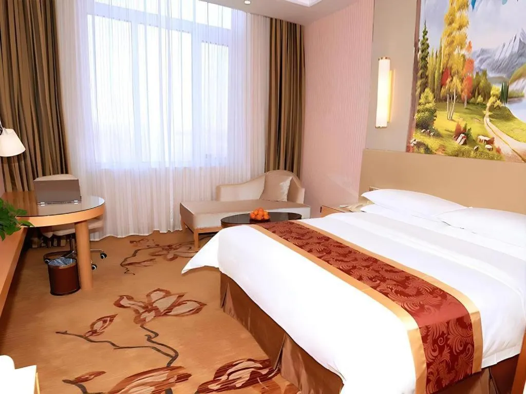Bed in Vienna Hotel Shandong Qufu Sankong Landscape