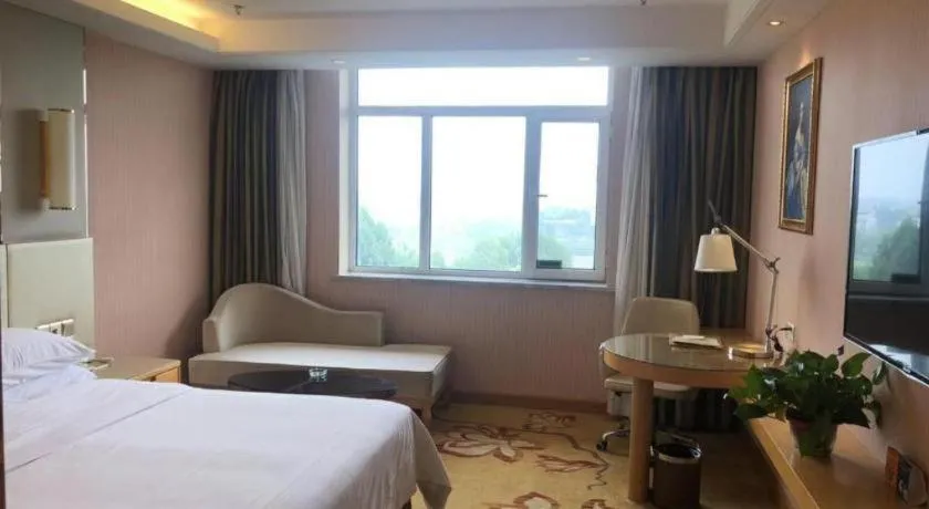 Bed in Vienna Hotel Shandong Qufu Sankong Landscape