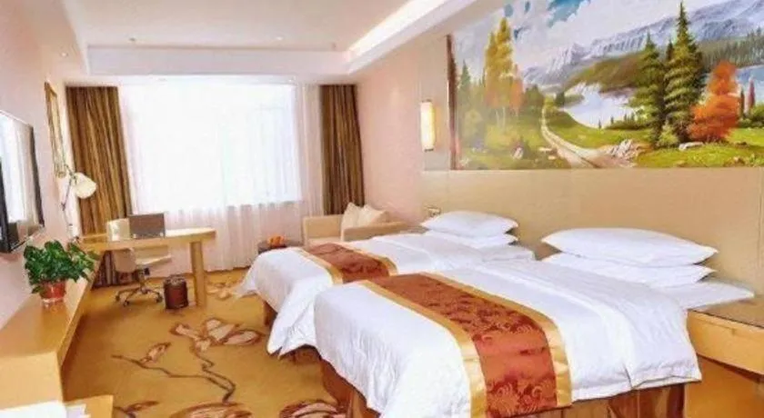 Bed in Vienna Hotel Shandong Qufu Sankong Landscape