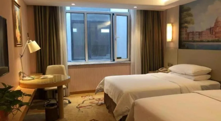 Bed in Vienna Hotel Shandong Qufu Sankong Landscape
