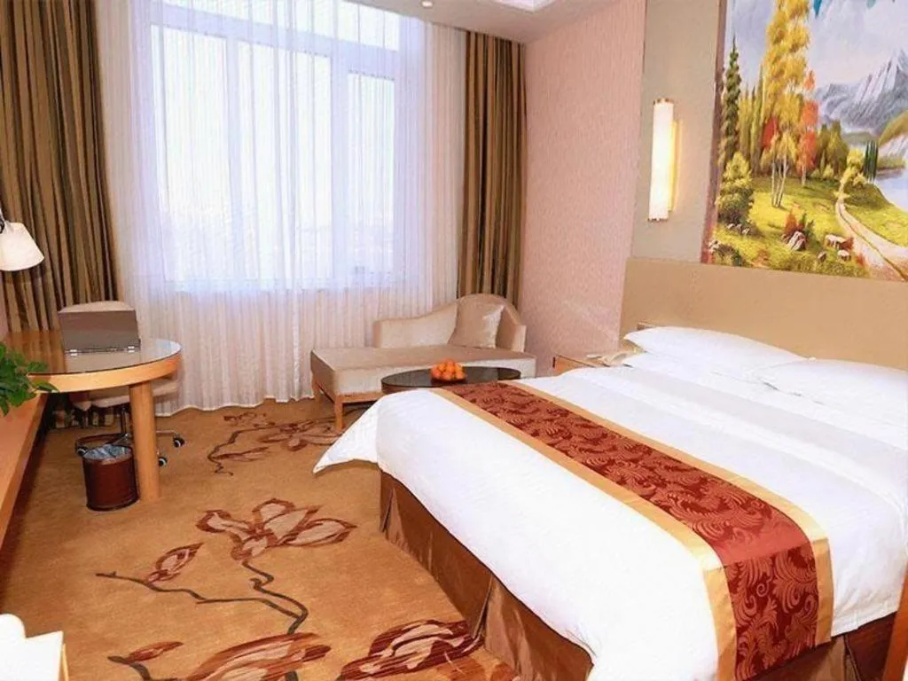 Bed in Vienna Hotel Shandong Qufu Sankong Landscape