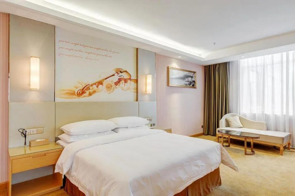 Bed in Vienna Hotel Shandong Qufu Sankong Landscape