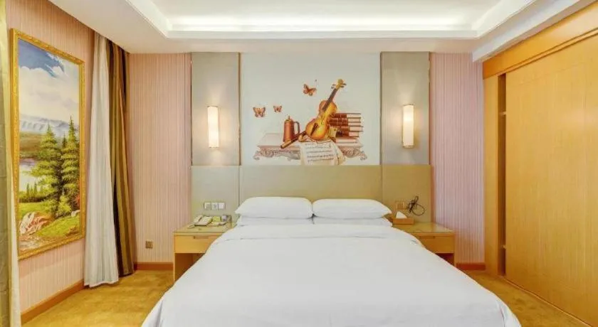 Bed in Vienna Hotel Shandong Qufu Sankong Landscape