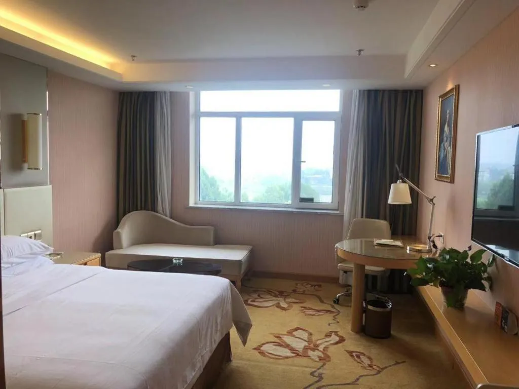 Bed in Vienna Hotel Shandong Qufu Sankong Landscape