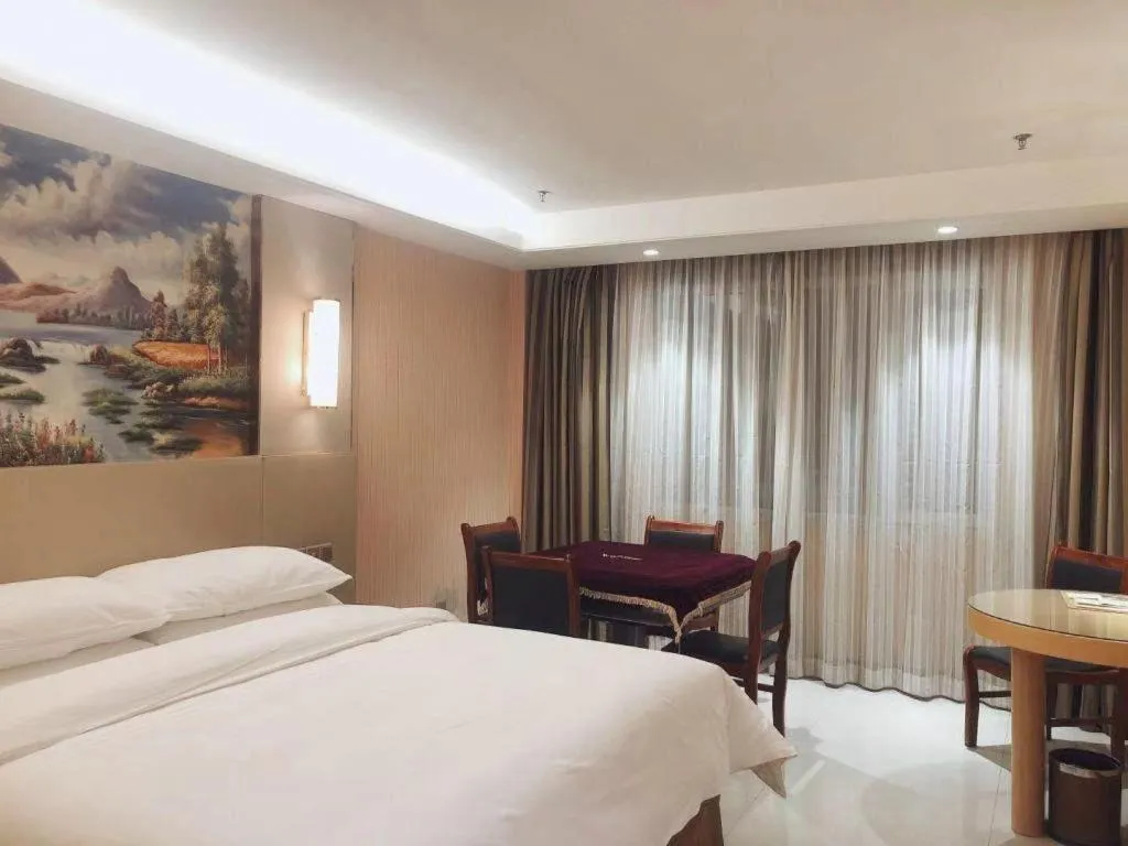 Bed in Vienna Hotel Shandong Qufu Sankong Landscape