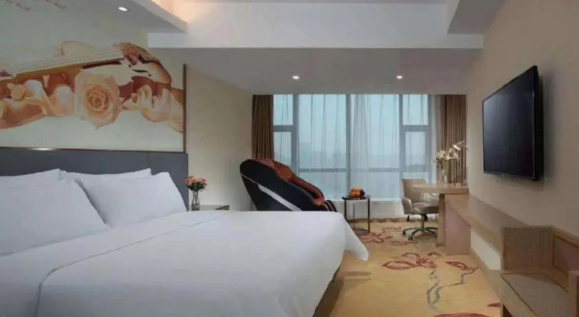 Bed in Vienna Hotel Shaanxi Hanzhong Central Square High-Speed Railway Station