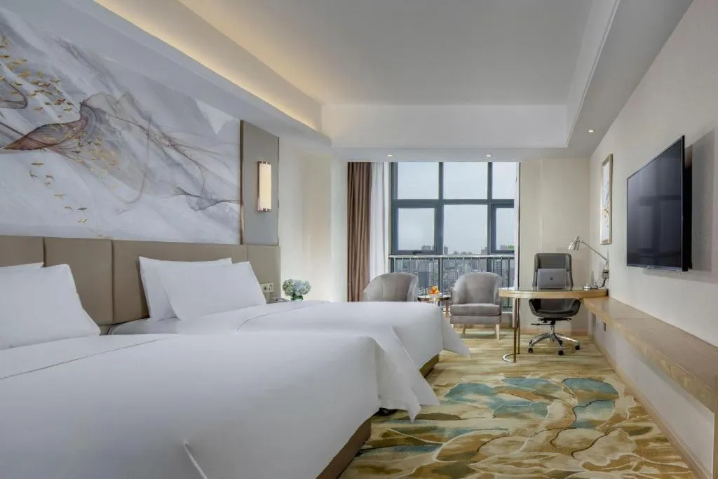 Bed in Vienna Hotel Shaanxi Hanzhong Central Square High-Speed Railway Station