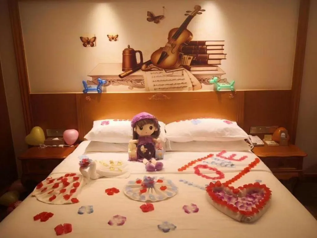 Bed in Vienna Hotel Shaanxi Hanzhong Central Square High-Speed Railway Station