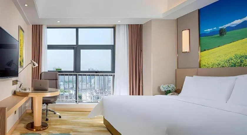 Bed in Vienna Hotel Shaanxi Hanzhong Central Square High-Speed Railway Station