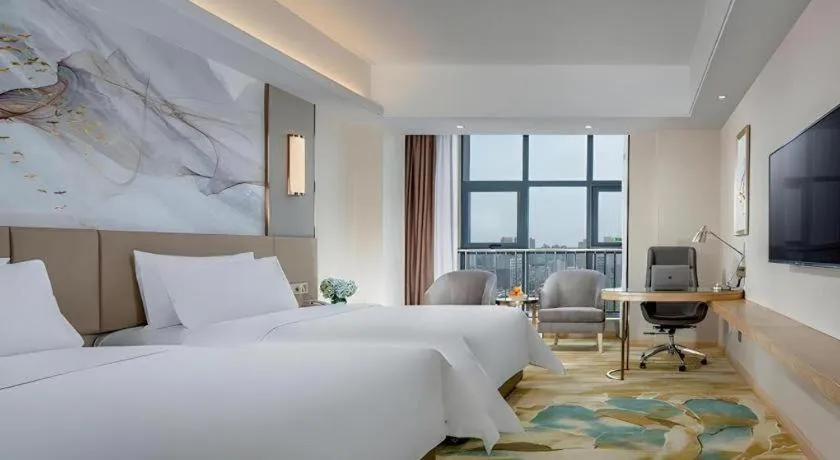 Bed in Vienna Hotel Shaanxi Hanzhong Central Square High-Speed Railway Station