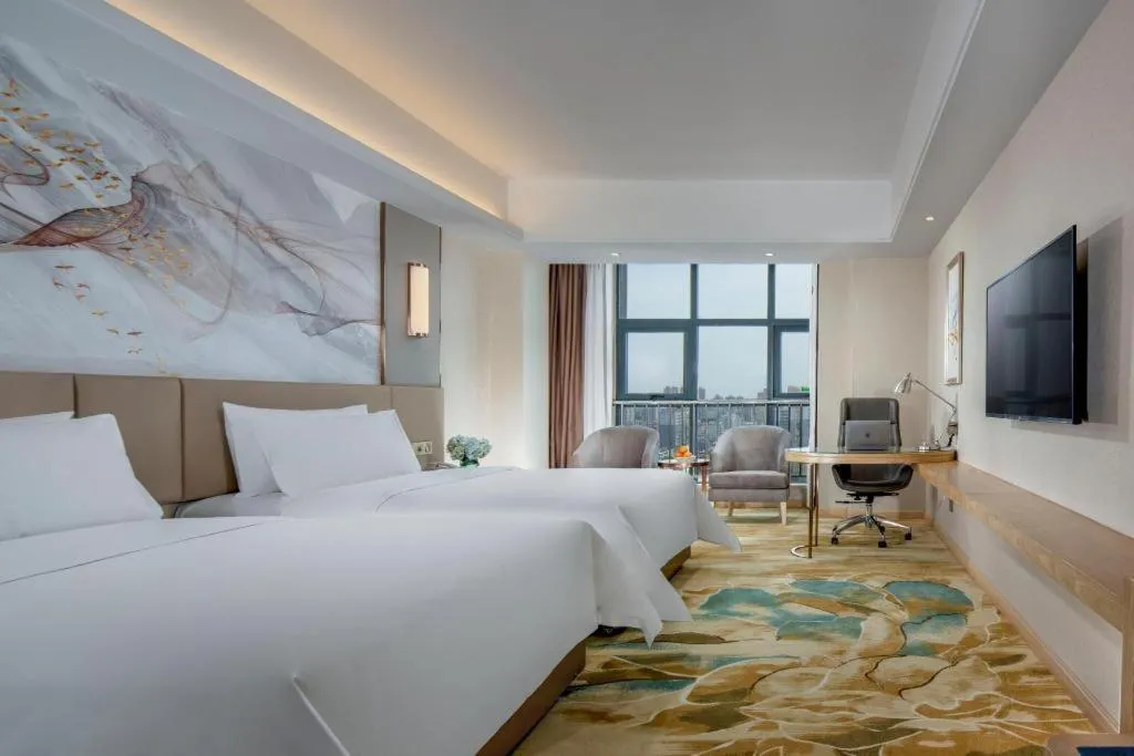 Bed in Vienna Hotel Shaanxi Hanzhong Central Square High-Speed Railway Station