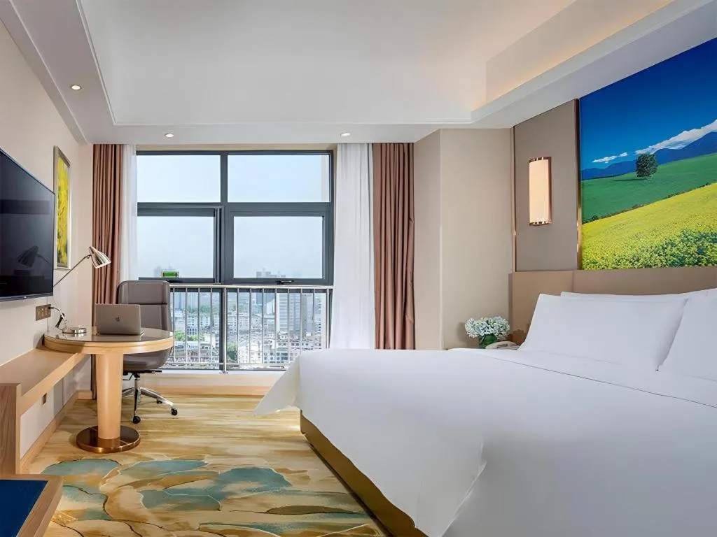 Bed in Vienna Hotel Shaanxi Hanzhong Central Square High-Speed Railway Station