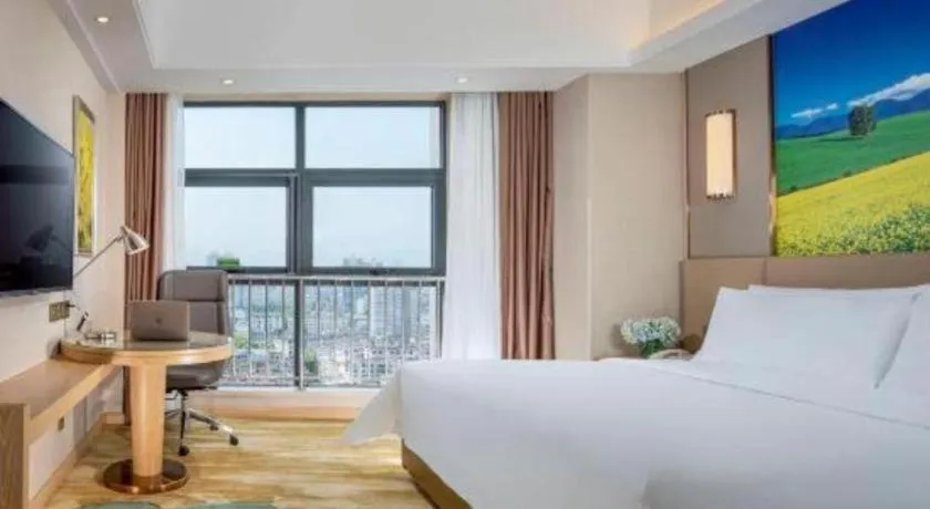 Bed in Vienna Hotel Shaanxi Hanzhong Central Square High-Speed Railway Station