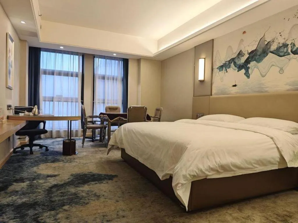 Bed in Vienna Hotel Shaanxi Hanzhong Central Square High-Speed Railway Station