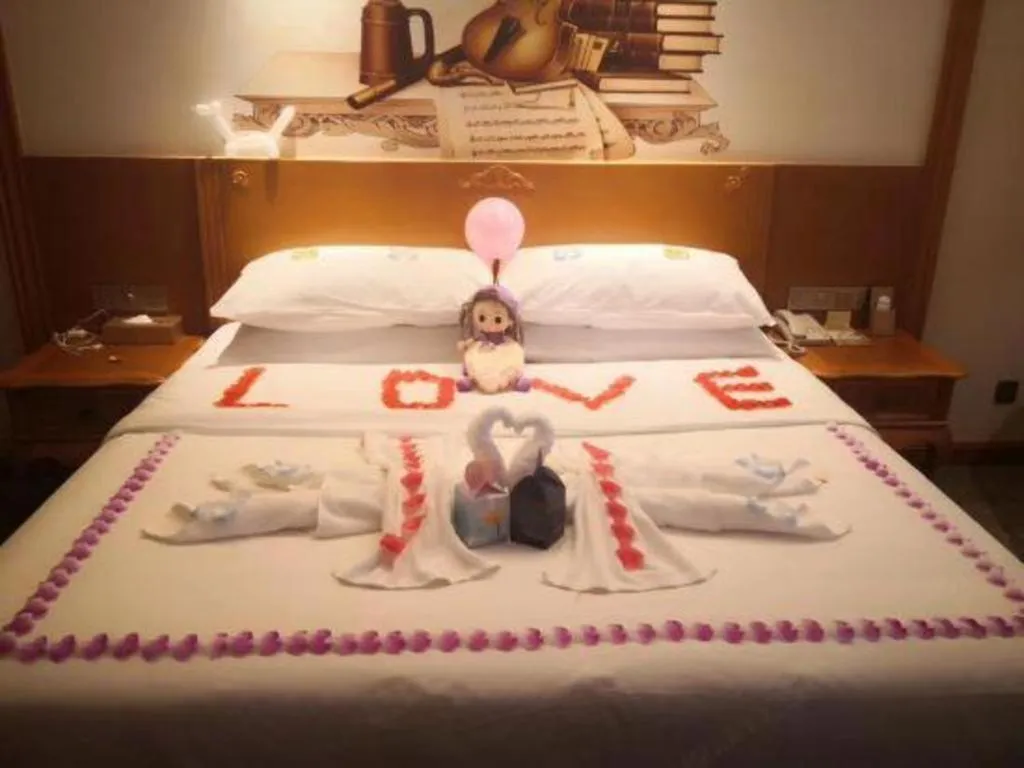 Bed in Vienna Hotel Shaanxi Hanzhong Central Square High-Speed Railway Station