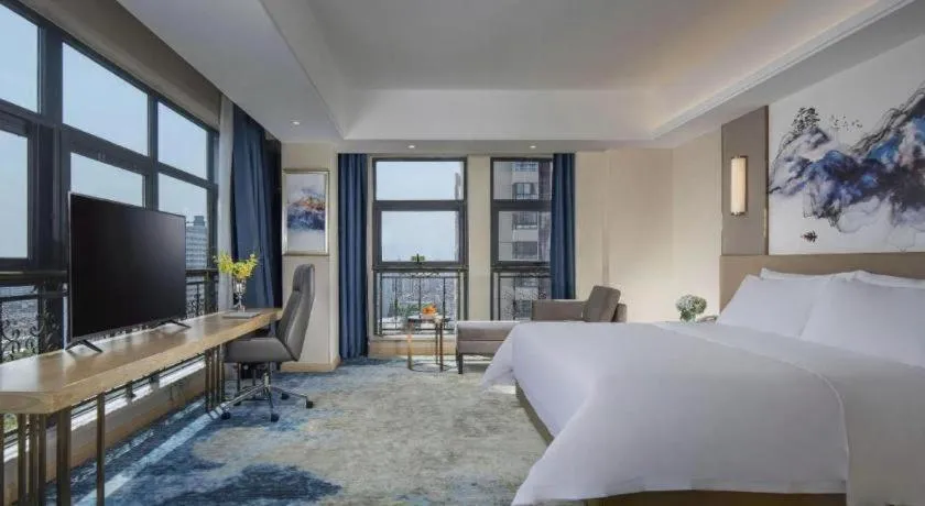 Bed in Vienna Hotel Shaanxi Hanzhong Central Square High-Speed Railway Station