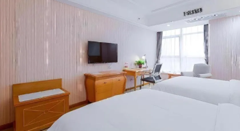 Bed in Vienna Hotel Shaanxi Ankang Jiangnan