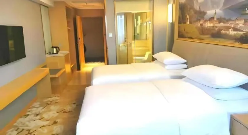 Bed in Vienna Hotel Guangdong Zhongshan South Area Passenger Station