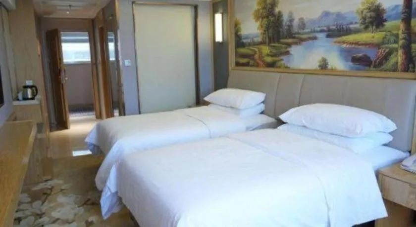 Bed in Vienna Hotel Guangdong Zhongshan South Area Passenger Station