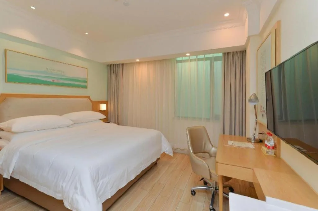 Bed in Vienna Hotel Guangdong Foshan Shunde Longjiang Material City