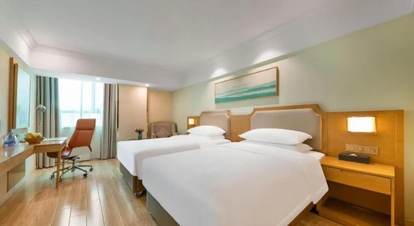 Bed in Vienna Hotel Guangdong Foshan Shunde Longjiang Material City
