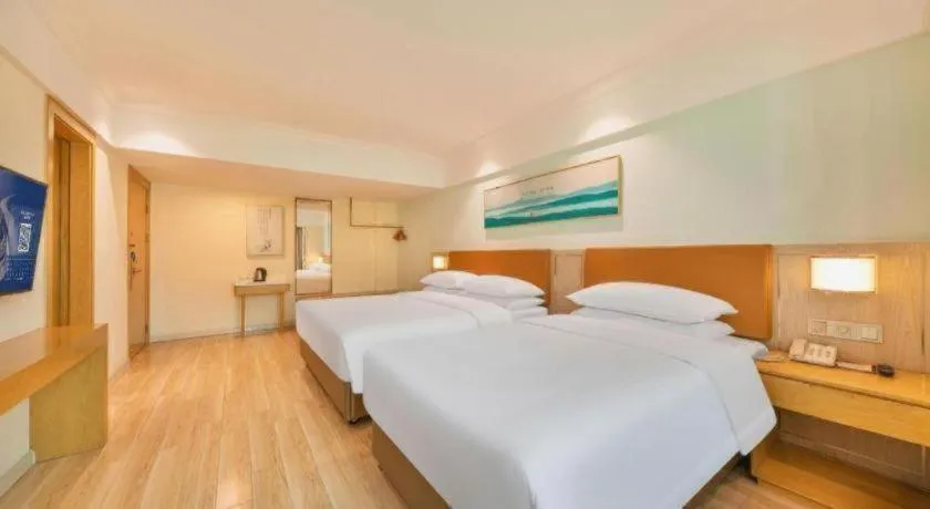 Bed in Vienna Hotel Guangdong Foshan Shunde Longjiang Material City