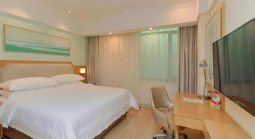 Bed in Vienna Hotel Guangdong Foshan Shunde Longjiang Material City