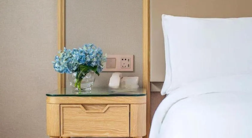 Bed in Vienna Hotel Yunnan Dali Erhai Lake