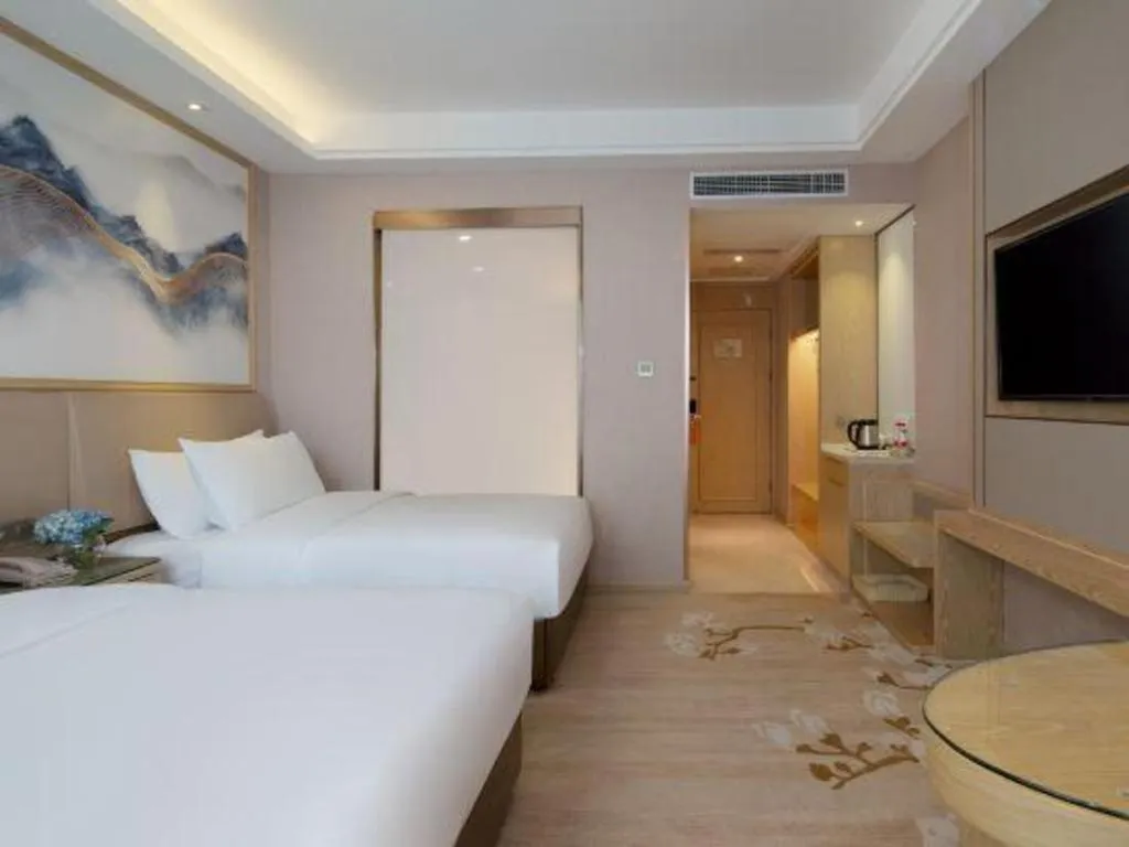 Bed in Vienna Hotel Yunnan Dali Erhai Lake