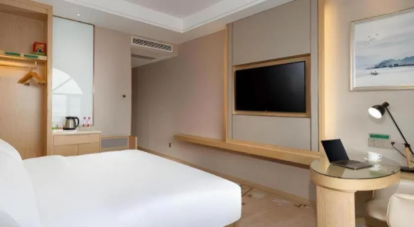 Bed in Vienna Hotel Yunnan Dali Erhai Lake